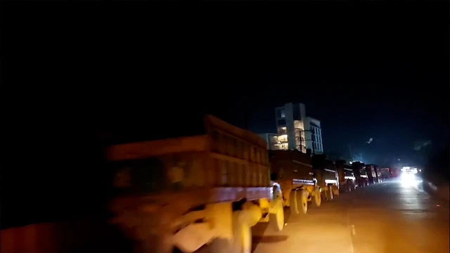 রাতের আঁধারে শত শত ট্রাকে সরানো হচ্ছে সাদা পাথর
